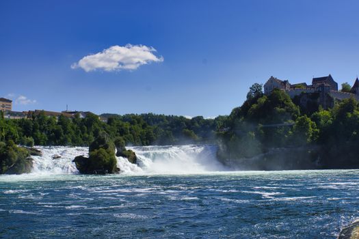 the famous rhine falls in the swiss near the city of Schaffhausen - sunny day and blue sky