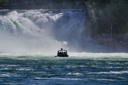 the famous rhine falls in the swiss near the city of Schaffhausen - sunny day and blue sky