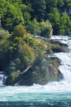 the famous rhine falls in the swiss near the city of Schaffhausen - sunny day and blue sky