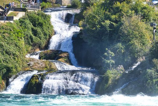 the famous rhine falls in the swiss near the city of Schaffhausen - sunny day and blue sky