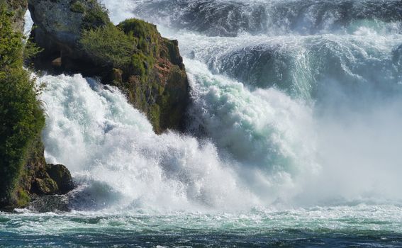 the famous rhine falls in the swiss near the city of Schaffhausen - sunny day and blue sky