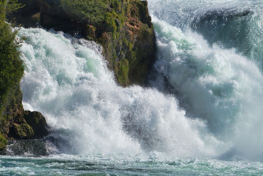 the famous rhine falls in the swiss near the city of Schaffhausen - sunny day and blue sky