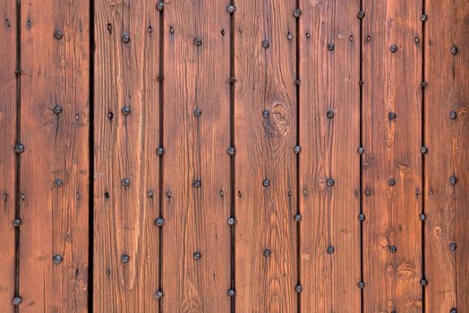 Background or texture made of wooden planks with nails