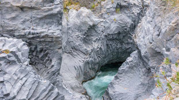 Basalt rocks formations of the gorge of Alcantara river, Sicily, Italy