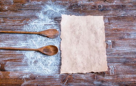 Blank cookbook with some ingredients on the wooden table, top view, rustic style.