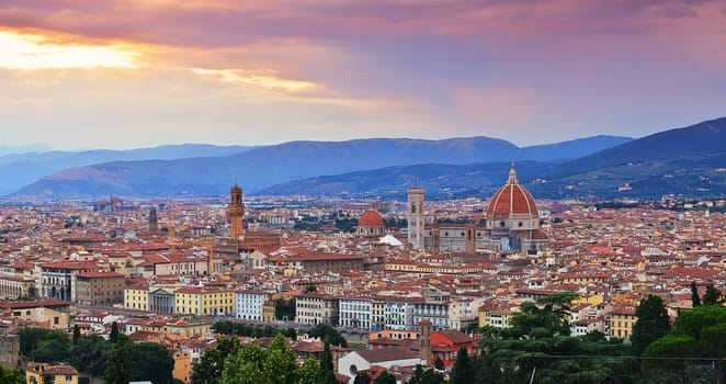 Florence, Italy - June 27, 2018: Panorama of Duomo Santa Maria Del Fiore and tower of Palazzo Vecchio at sunset in Florence, Tuscany, Italy