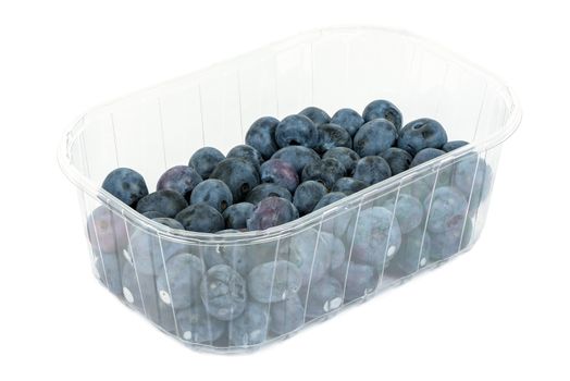 Blueberries in a plastic container isolated on white background with clipping path