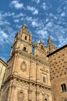 Famous Casa de las Conchas with La Clerecia Church in Salamanca, Castilla y Leon, Spain.