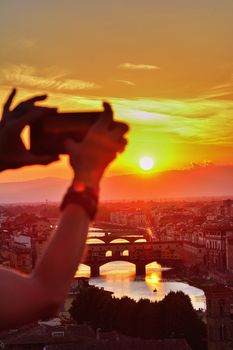 Famous bridge Ponte Vecchio at sunset in Florence, Tuscany, Italy