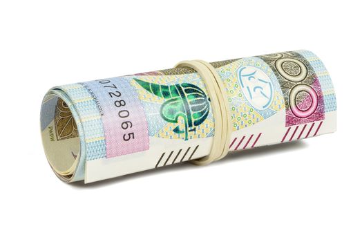 Polish banknotes of 500 PLN rolled with rubber isolated on white background with clipping path