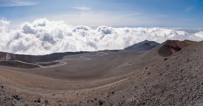 Lunar landscape of the Mount Etna with road on the lava field , Sicily, Italy