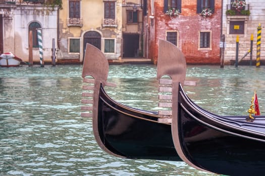 Two gondolas sailing through a canal in Venice, Italy.