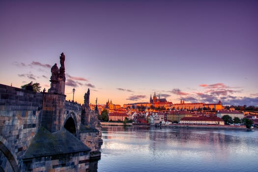 Scenic view on Vltava river and historical center of Prague, buildings and landmarks of old town, Prague, Czech Republic. Charles Bridge (Karluv Most) and Lesser Town Tower, Prague, Czechia