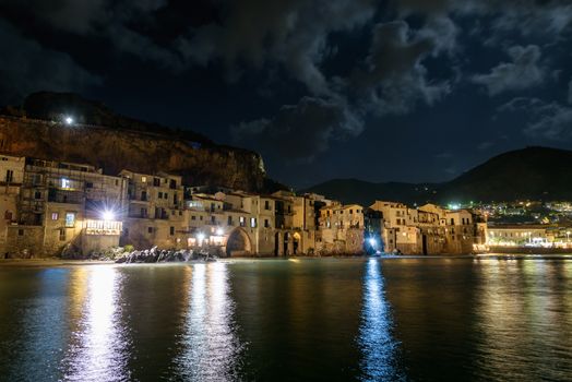 View of coast in Cefalu town on Sicily by night, Italy
