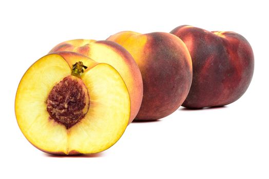 Ripe peaches in a row isolated on white background with clipping path