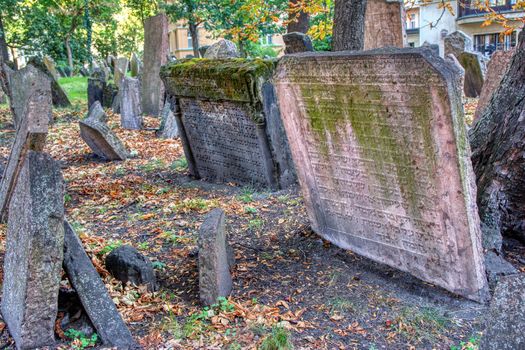 Prague, Czech Republic - September 26, 2018: Tombstones on Old Jewish Cemetery in the Jewish Quarter in Prague.There are about 12000 tombstones presently visible. One of the most important Jewish monument.