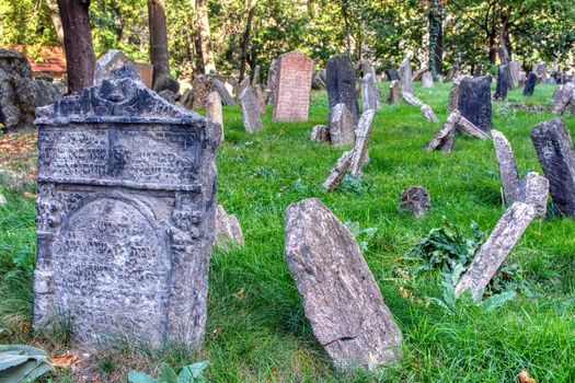 Prague, Czech Republic - September 26, 2018: Tombstones on Old Jewish Cemetery in the Jewish Quarter in Prague.There are about 12000 tombstones presently visible. One of the most important Jewish monument.