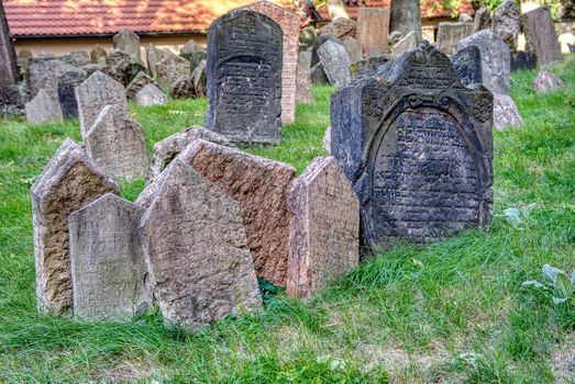 Prague, Czech Republic - September 26, 2018: Tombstones on Old Jewish Cemetery in the Jewish Quarter in Prague.There are about 12000 tombstones presently visible. One of the most important Jewish monument.