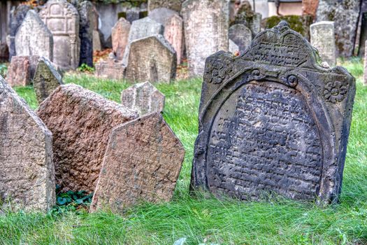 Prague, Czech Republic - September 26, 2018: Tombstones on Old Jewish Cemetery in the Jewish Quarter in Prague.There are about 12000 tombstones presently visible. One of the most important Jewish monument.