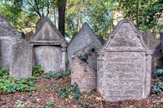 Prague, Czech Republic - September 26, 2018: Tombstones on Old Jewish Cemetery in the Jewish Quarter in Prague.There are about 12000 tombstones presently visible. One of the most important Jewish monument.