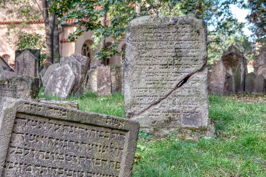 Prague, Czech Republic - September 26, 2018: Tombstones on Old Jewish Cemetery in the Jewish Quarter in Prague.There are about 12000 tombstones presently visible. One of the most important Jewish monument.