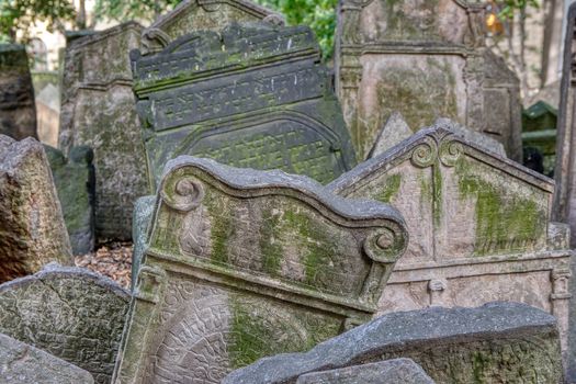 Prague, Czech Republic - September 26, 2018: Tombstones on Old Jewish Cemetery in the Jewish Quarter in Prague.There are about 12000 tombstones presently visible. One of the most important Jewish monument.