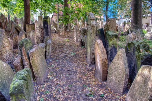 Prague, Czech Republic - September 26, 2018: Tombstones on Old Jewish Cemetery in the Jewish Quarter in Prague.There are about 12000 tombstones presently visible. One of the most important Jewish monument.