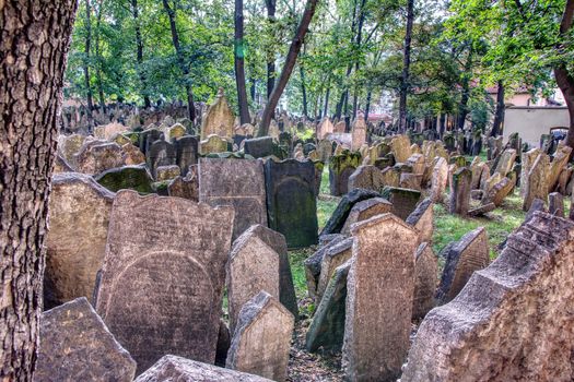 Prague, Czech Republic - September 26, 2018: Tombstones on Old Jewish Cemetery in the Jewish Quarter in Prague.There are about 12000 tombstones presently visible. One of the most important Jewish monument.