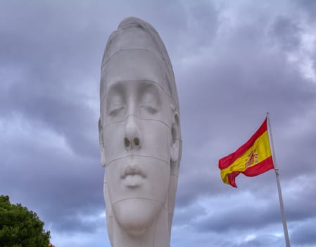 Madrid, Spain - November 30, 2019: Julia sculpture by Jaume Plensa at Colon Square sponsored by Cristina Masaveu Foundation