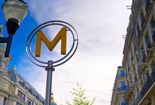 Paris, France - April 21, 2019 - A sign that marks the entrance to a metro station for the Paris underground subway system in France. 