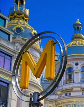 Paris, France - April 21, 2019 - A sign that marks the entrance to a metro station for the Paris underground subway system in France. 