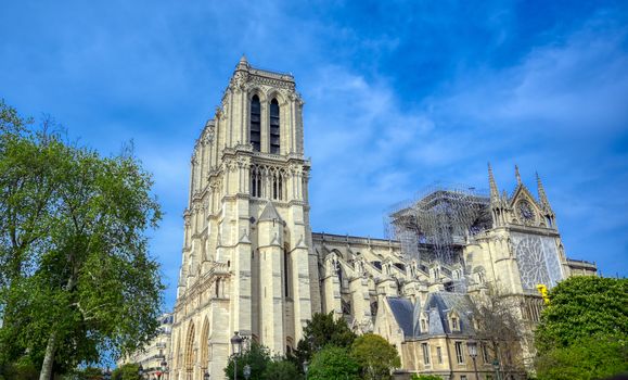 Paris, France - April 21, 2019 - Notre Dame Cathedral on the Seine River in Paris, France after the fire on April 15, 2019.