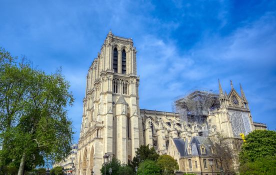 Paris, France - April 21, 2019 - Notre Dame Cathedral on the Seine River in Paris, France after the fire on April 15, 2019.