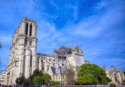 Paris, France - April 21, 2019 - Notre Dame Cathedral on the Seine River in Paris, France after the fire on April 15, 2019.