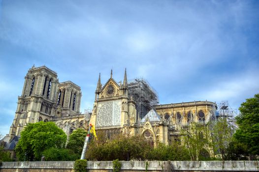 Paris, France - April 21, 2019 - Notre Dame Cathedral on the Seine River in Paris, France after the fire on April 15, 2019.