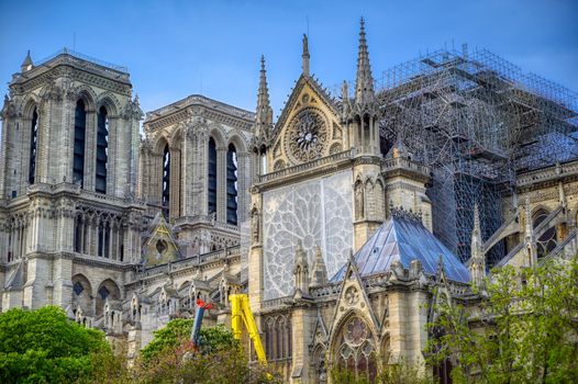 Paris, France - April 21, 2019 - Notre Dame Cathedral on the Seine River in Paris, France after the fire on April 15, 2019.