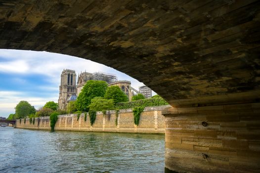 Paris, France - April 21, 2019 - Notre Dame Cathedral on the Seine River in Paris, France after the fire on April 15, 2019.