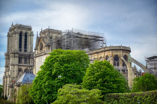 Paris, France - April 21, 2019 - Notre Dame Cathedral on the Seine River in Paris, France after the fire on April 15, 2019.