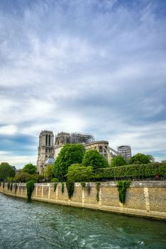 Paris, France - April 21, 2019 - Notre Dame Cathedral on the Seine River in Paris, France after the fire on April 15, 2019.