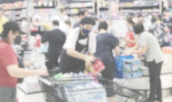 Abstract blurred background of people buying food in the supermarket because coronavirus disease
