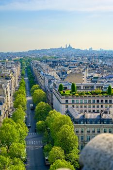 A view of Paris, France from the Arc de Triomphe on a sunny day.