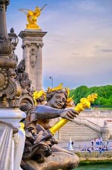 A view of the Pont Alexandre III bridge that spans the Seine River in Paris, France