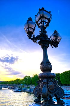 A view from the Pont Alexandre III bridge that spans the Seine River in Paris, France