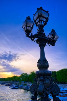 A view from the Pont Alexandre III bridge that spans the Seine River in Paris, France