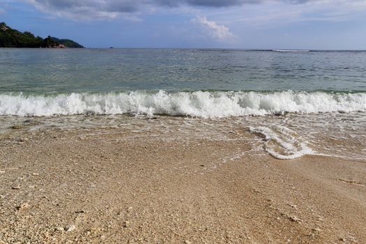 Stunning indian ocean waves at the beaches on the paradise island seychelles.