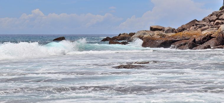 Stunning indian ocean waves at the beaches on the paradise island seychelles.