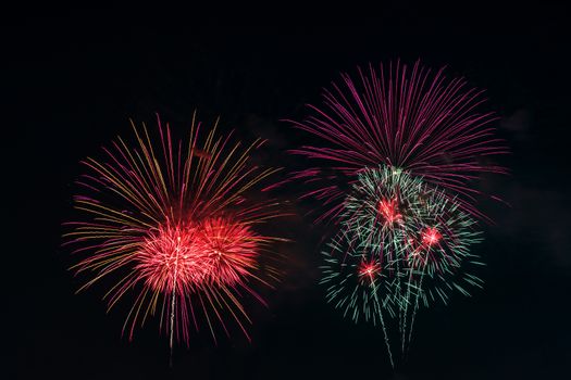 Colorful fireworks display at holiday night.