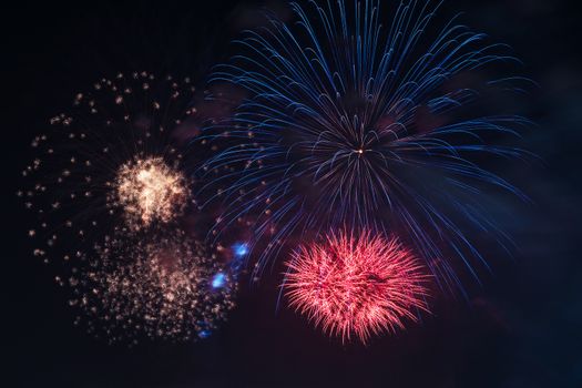 Colorful fireworks display at holiday night.