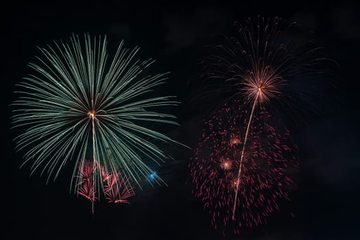 Colorful fireworks display at holiday night.