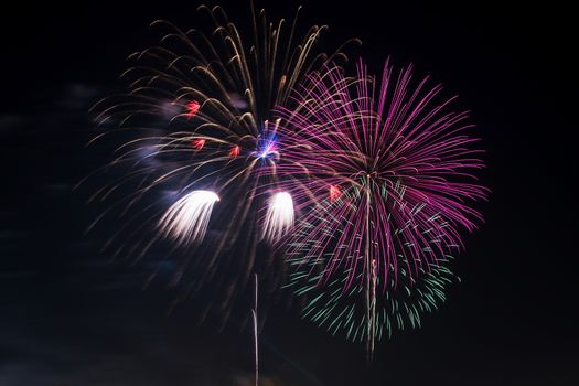 Colorful fireworks display at holiday night.